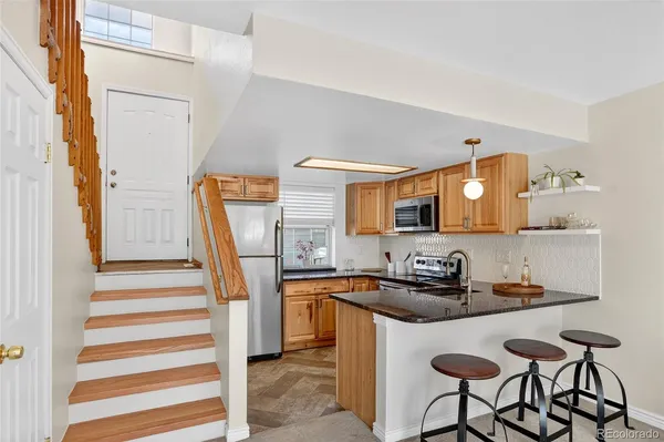 a dining room with a sink and a mirror