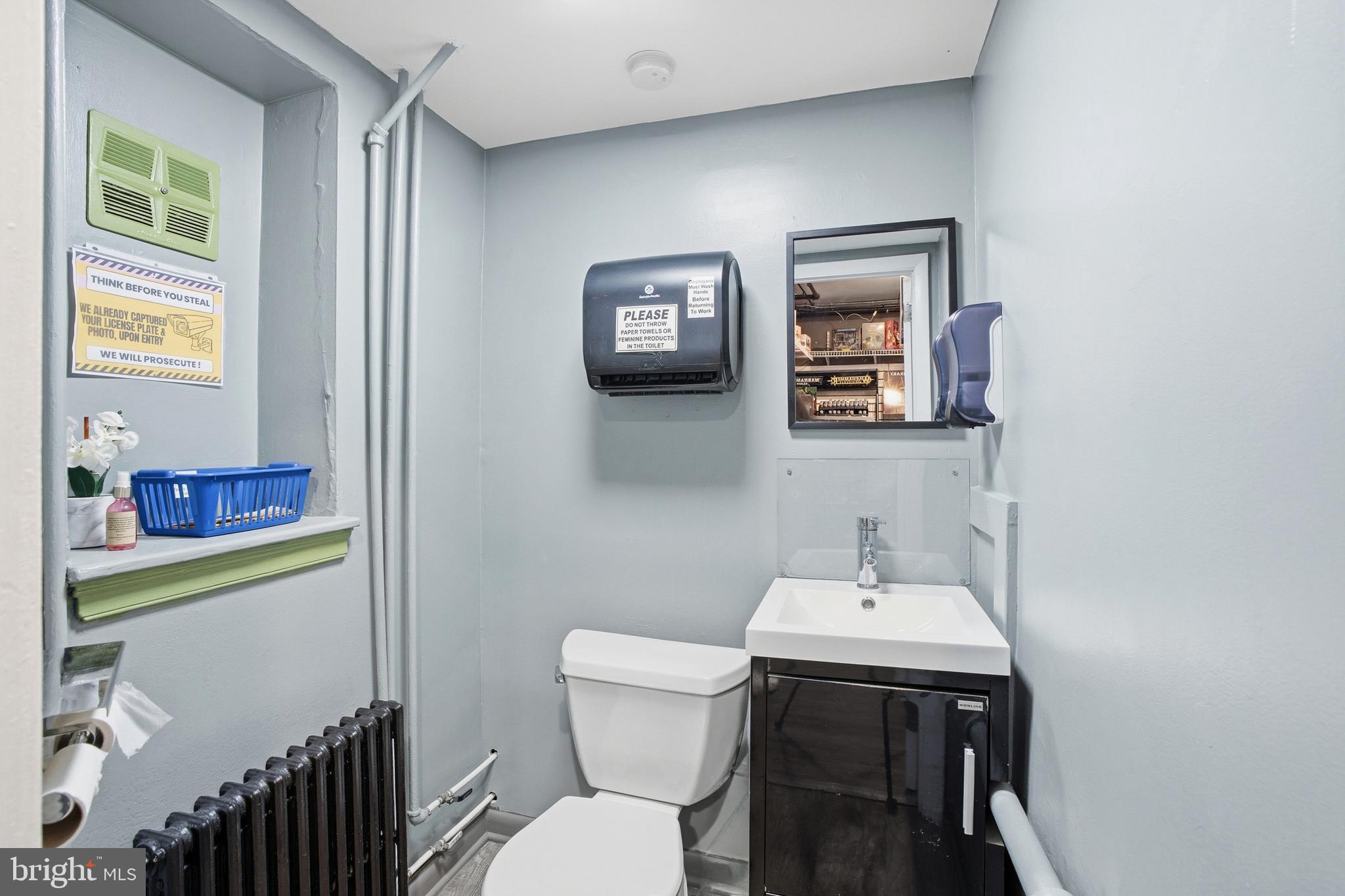119 York Road Warminster, PA 18974 - Photo 11 of 43 a bathroom with a toilet a sink and a mirror