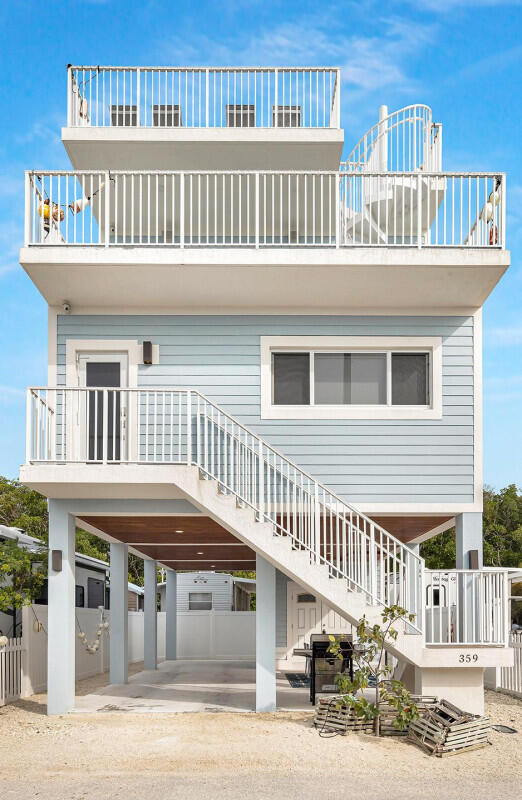 a front view of a house with a deck