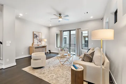 a dining room with furniture and wooden floor