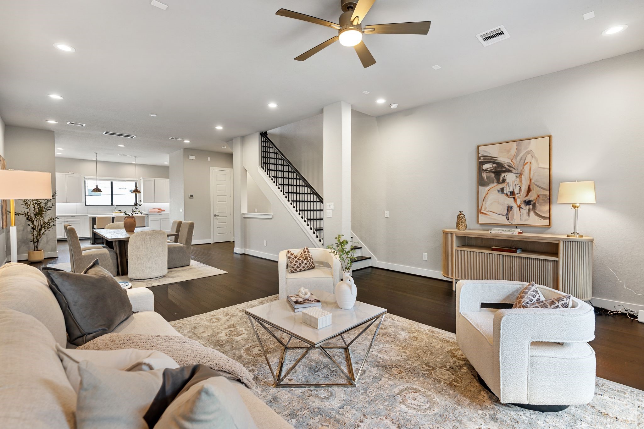 4219 Allen Street Houston, TX 77007 - Photo 13 of 29 a living room with furniture kitchen view and a chandelier