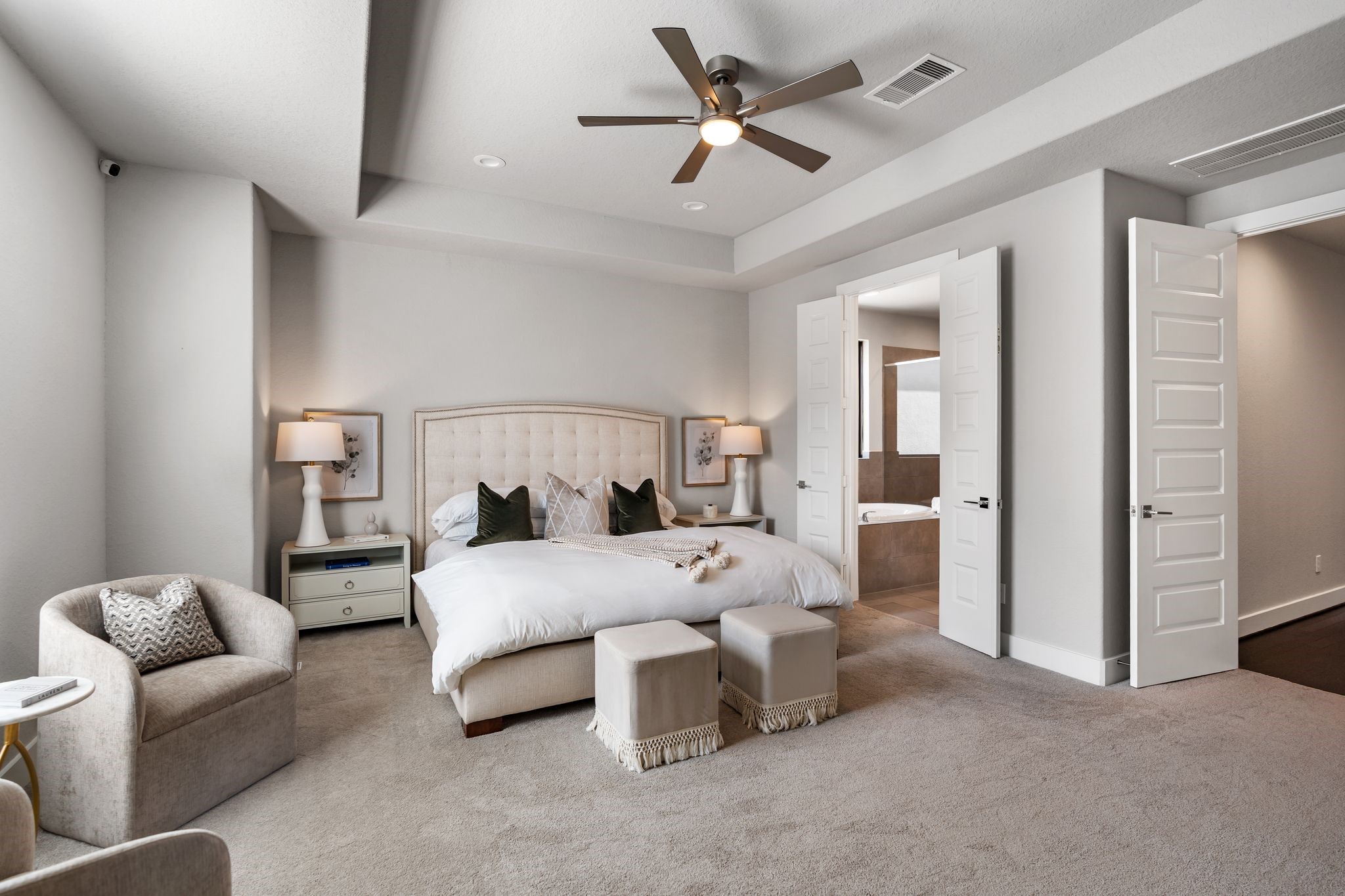 4219 Allen Street Houston, TX 77007 - Photo 17 of 29 a bedroom with a bed and a chandelier