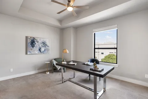 a spacious bathroom with a granite countertop tub sink and a mirror