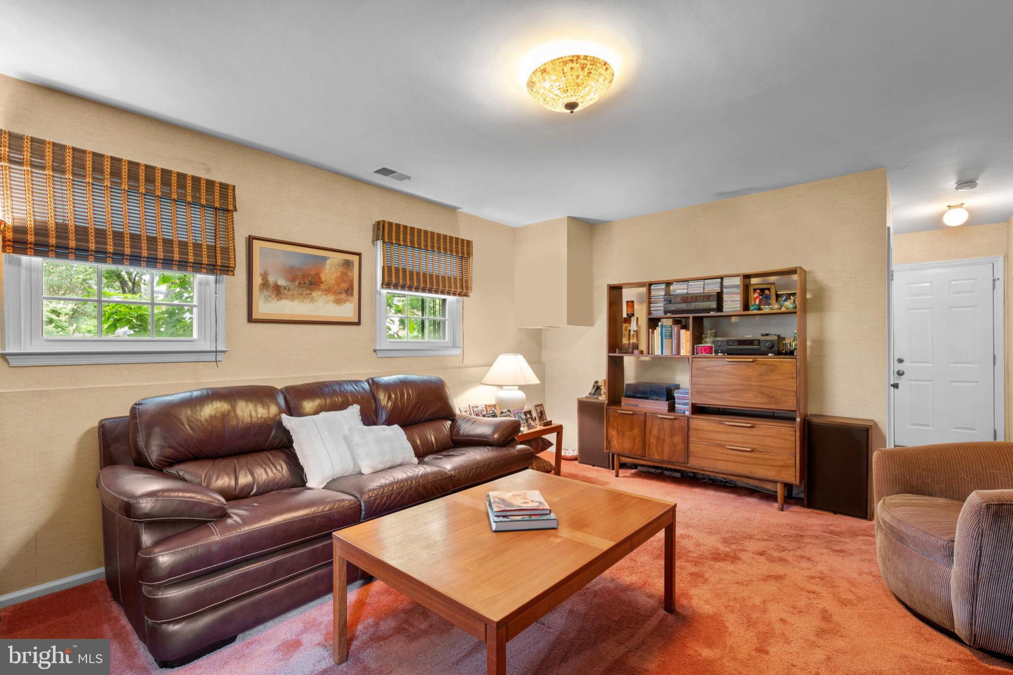1709 Glastonberry Road Rockville, MD 20854 - Photo 13 of 27 a living room with furniture and a window