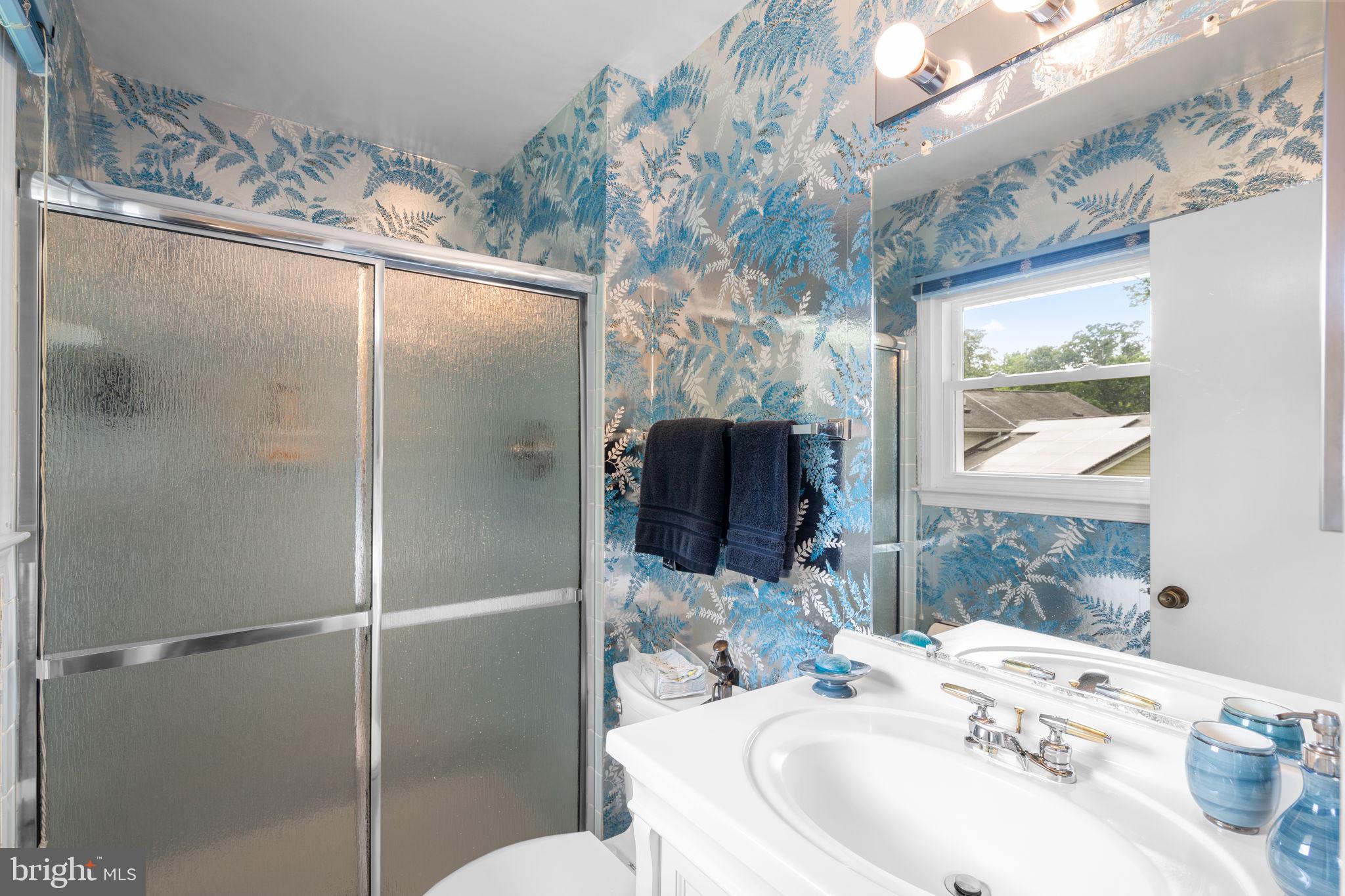 1709 Glastonberry Road Rockville, MD 20854 - Photo 19 of 27 a bathroom with a sink toilet and shower