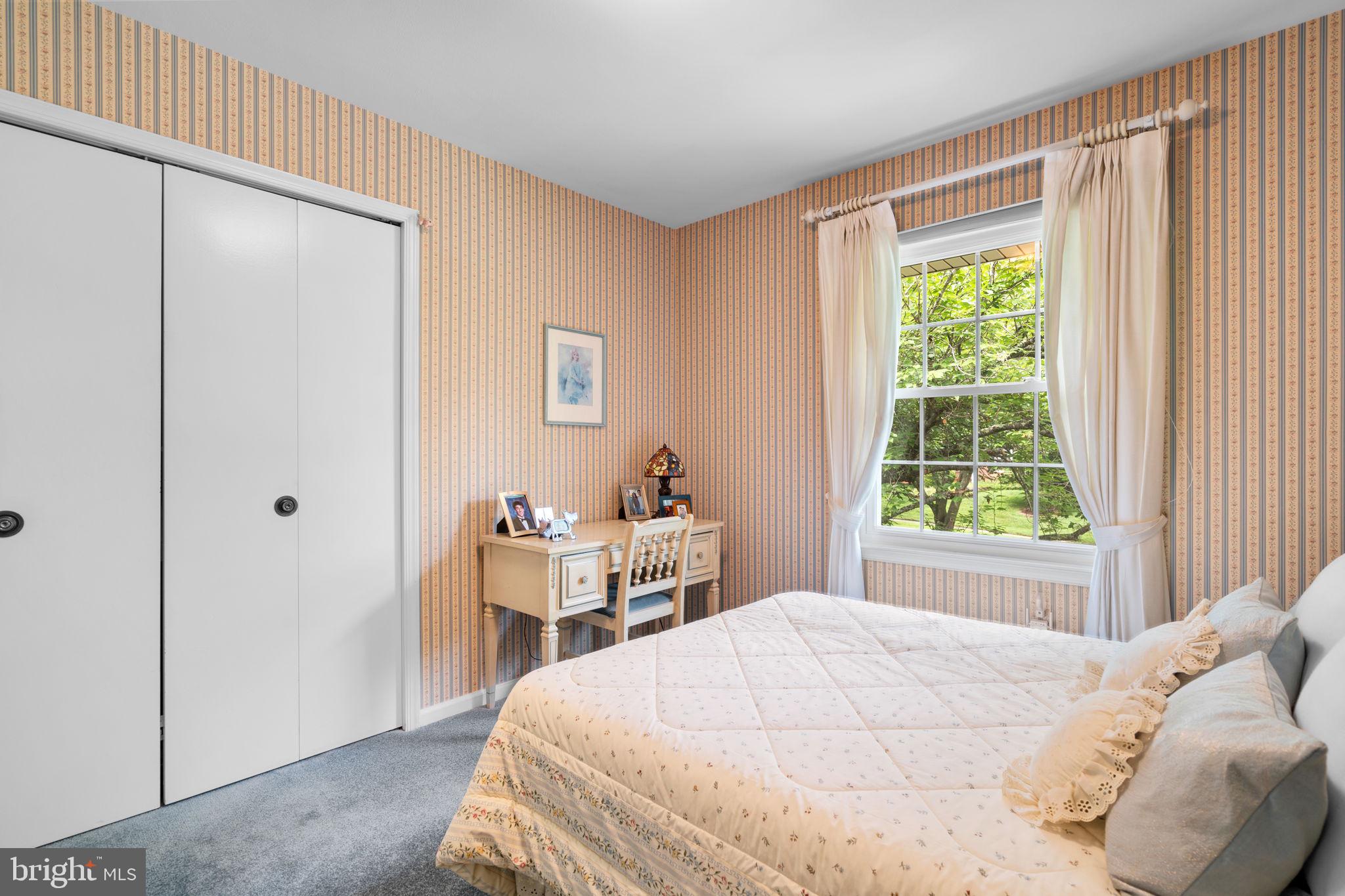 1709 Glastonberry Road Rockville, MD 20854 - Photo 21 of 27 a bedroom with a bed and a window