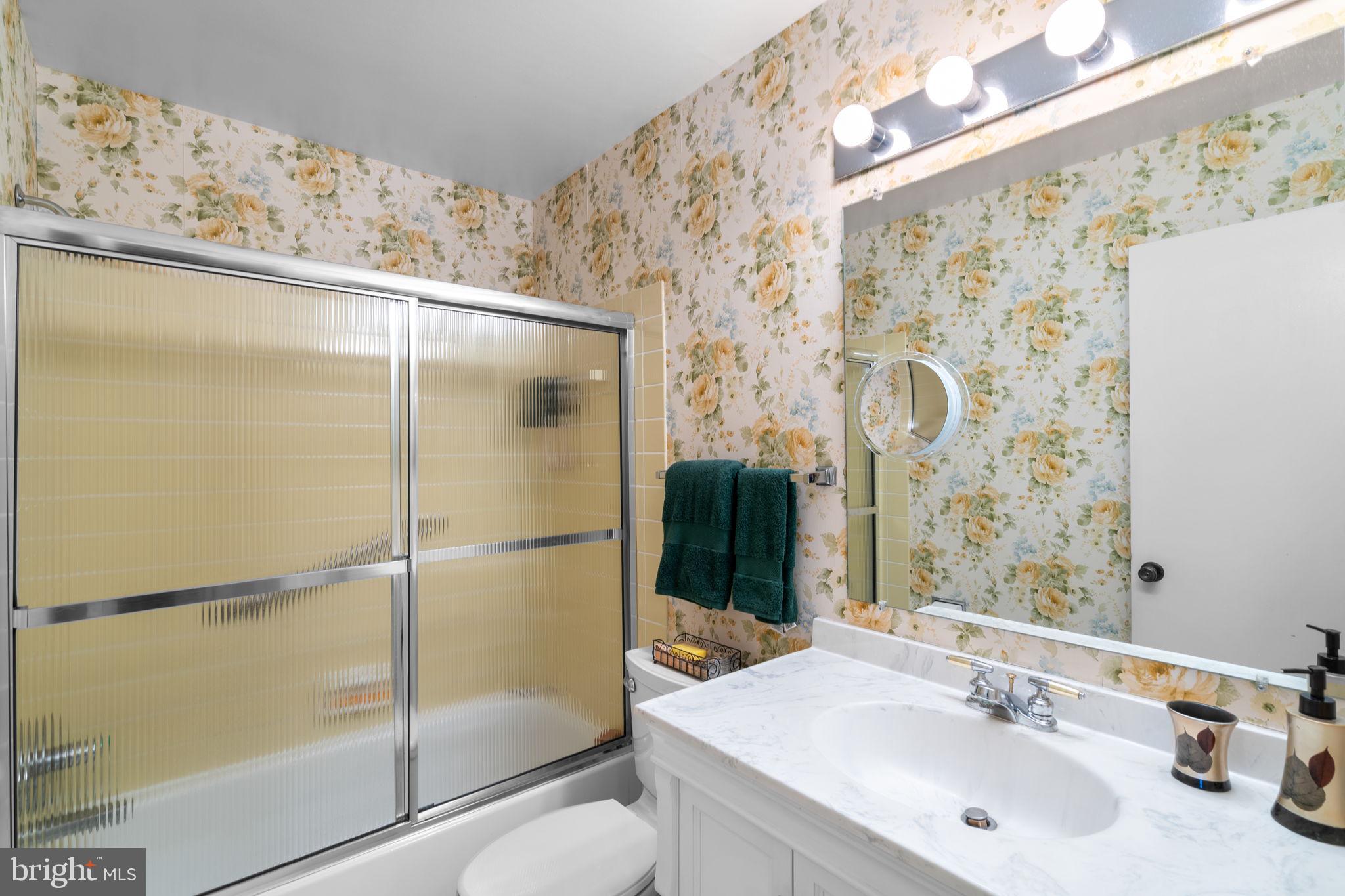 1709 Glastonberry Road Rockville, MD 20854 - Photo 22 of 27 a bathroom with a shower and a sink
