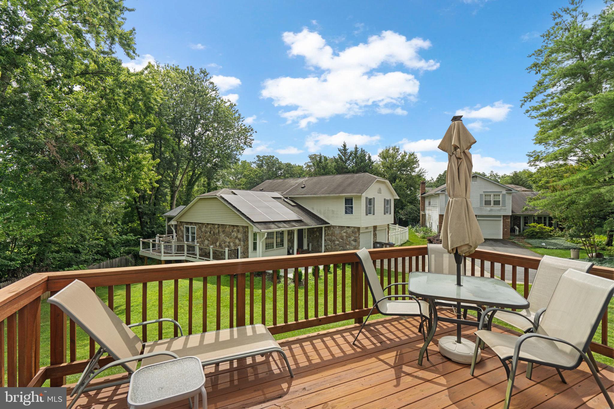 1709 Glastonberry Road Rockville, MD 20854 - Photo 24 of 27 a view of a chair and table on the deck