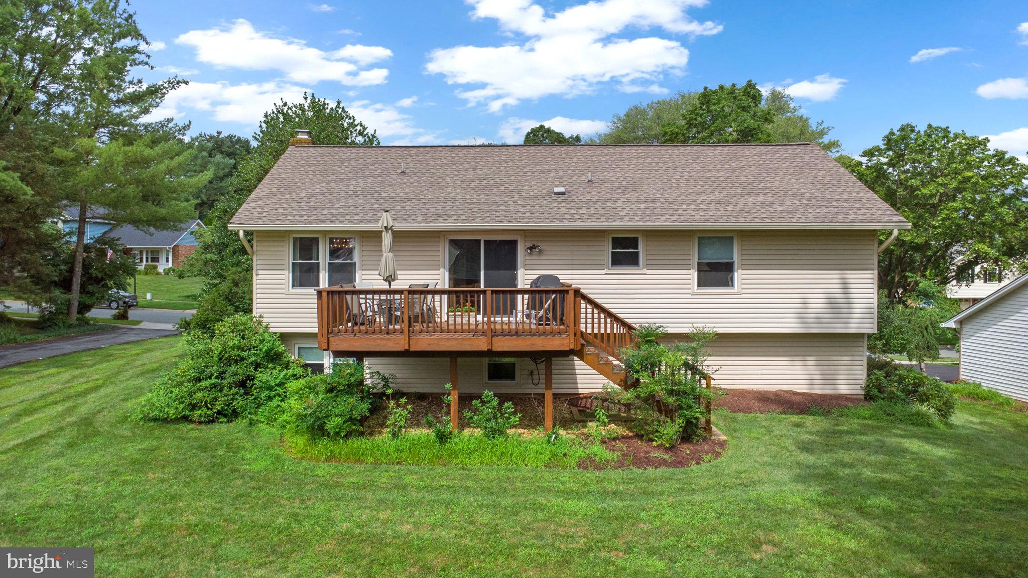 1709 Glastonberry Road Rockville, MD 20854 - Photo 25 of 27 a front view of a house with garden