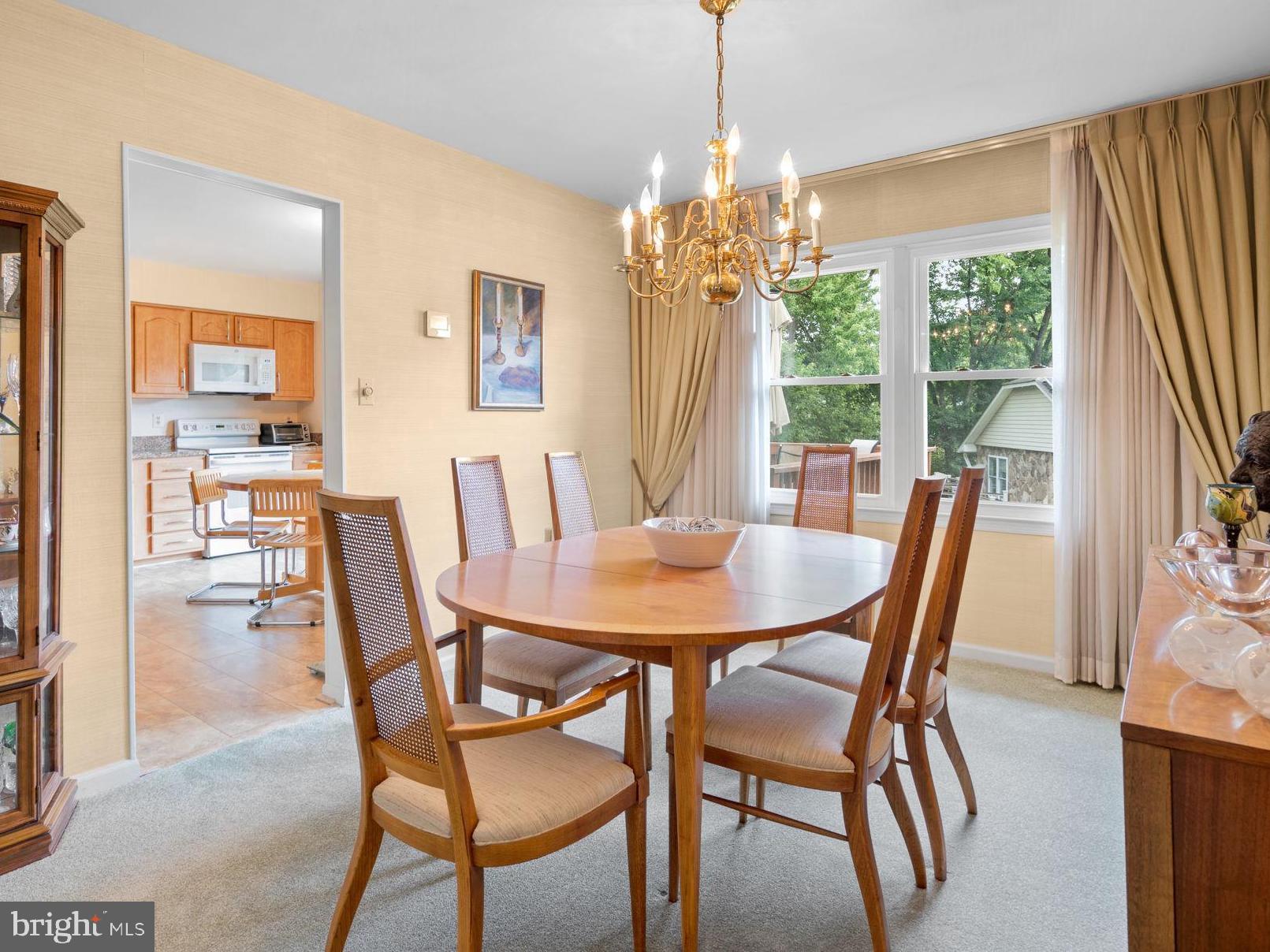 1709 Glastonberry Road Rockville, MD 20854 - Photo 7 of 27 a view of a dining room with furniture window and outside view