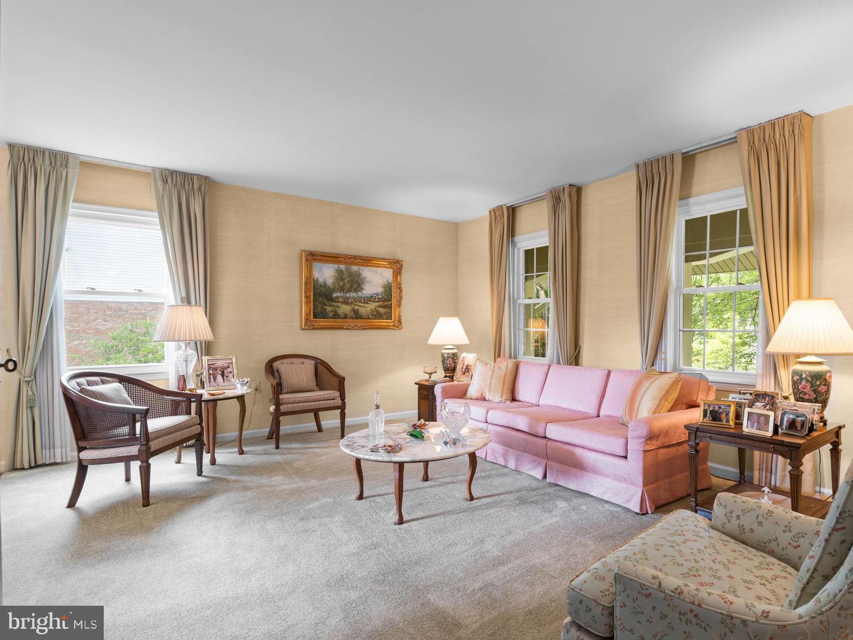 1709 Glastonberry Road Rockville, MD 20854 - Photo 10 of 27 a living room with furniture and a large window