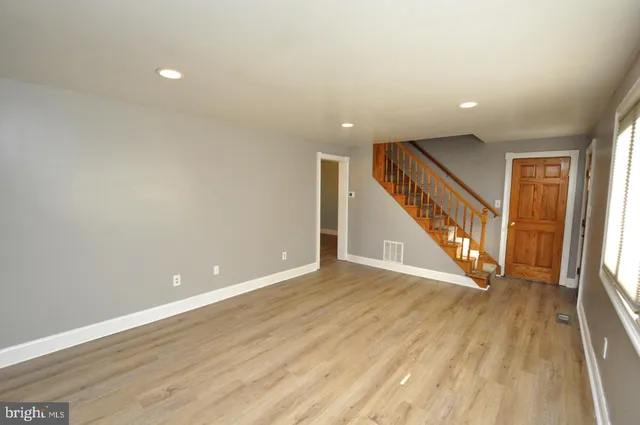 a view of an entryway with wooden floor