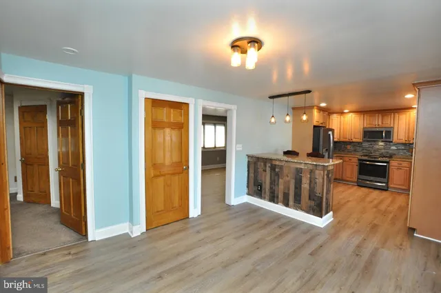a view of kitchen with wooden floor