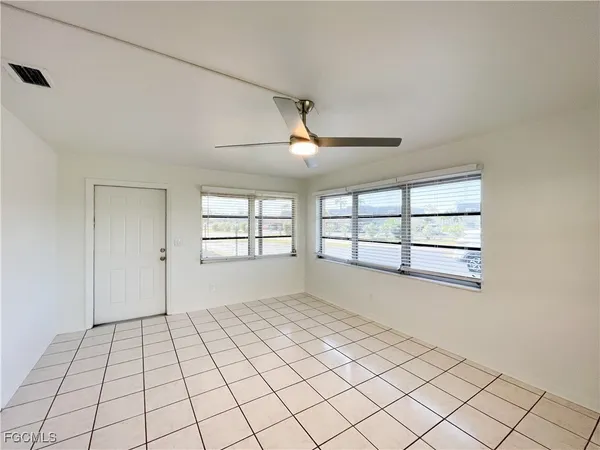 a view of an empty room with a window