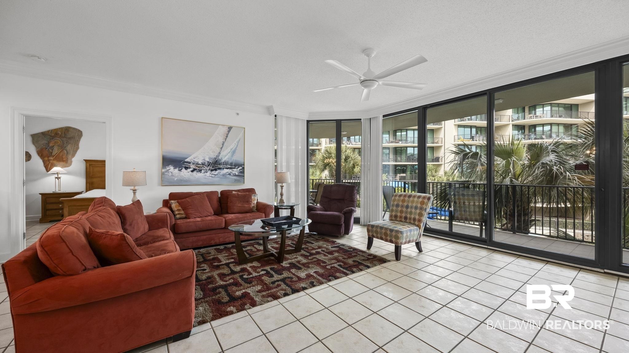 27580 Canal Road, Unit 1213 Orange Beach, AL 36561 - Photo 1 of 27 Spacious interior featuring large format tile flooring and crown molding