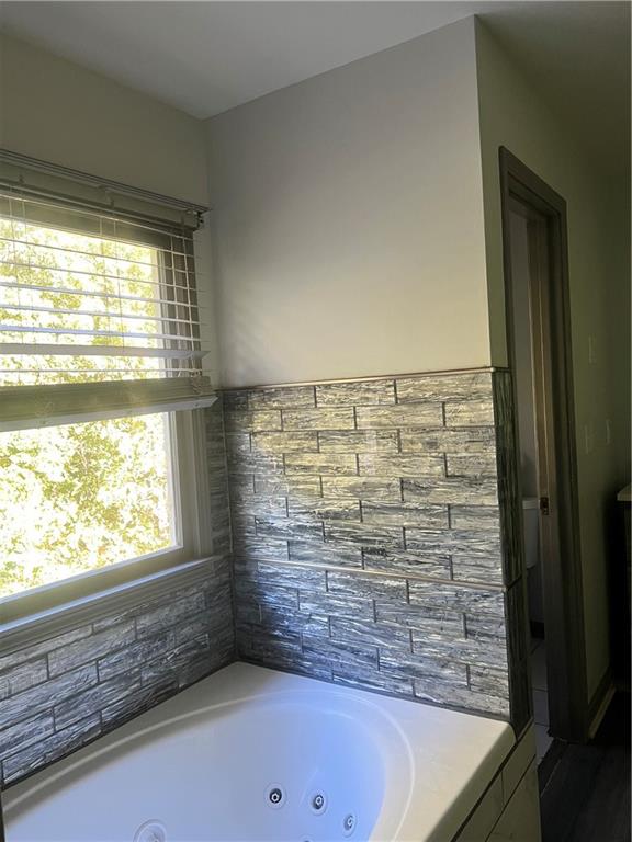 3335 Prairie Drive Snellville, GA 30039 - Photo 11 of 29 a bathroom with a bathtub