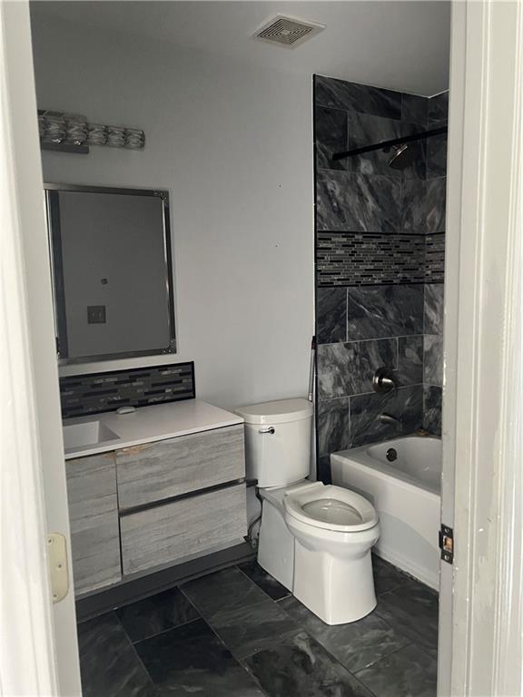 3335 Prairie Drive Snellville, GA 30039 - Photo 13 of 29 a bathroom with a toilet and a shower