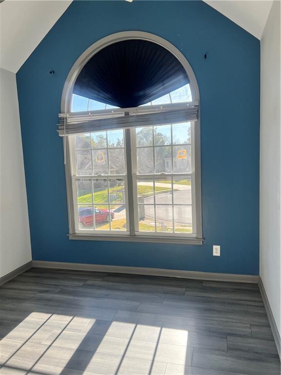 3335 Prairie Drive Snellville, GA 30039 - Photo 14 of 29 an empty room with wooden floor and windows