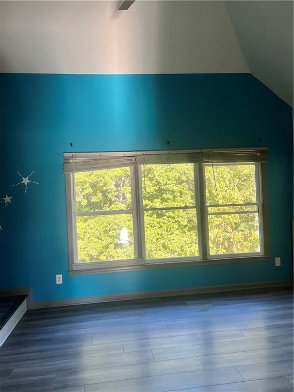 3335 Prairie Drive Snellville, GA 30039 - Photo 16 of 29 a view of an empty room with wooden floor and a window