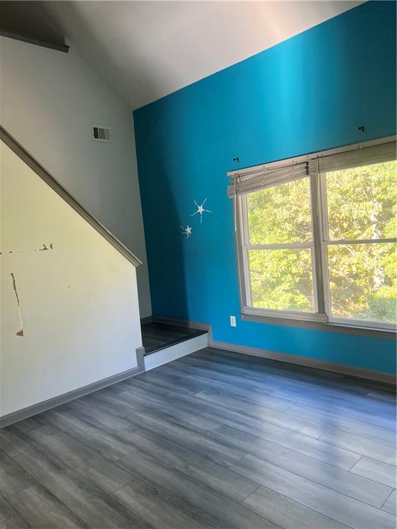 3335 Prairie Drive Snellville, GA 30039 - Photo 17 of 29 an empty room with wooden floor and windows