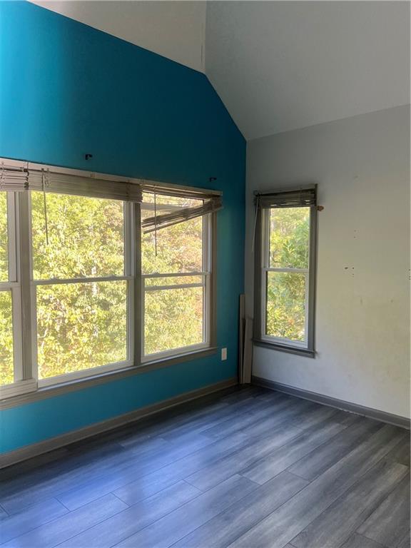 3335 Prairie Drive Snellville, GA 30039 - Photo 18 of 29 a view of an empty room with wooden floor and a window