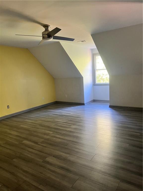 3335 Prairie Drive Snellville, GA 30039 - Photo 19 of 29 an empty room with wooden floor fan and windows