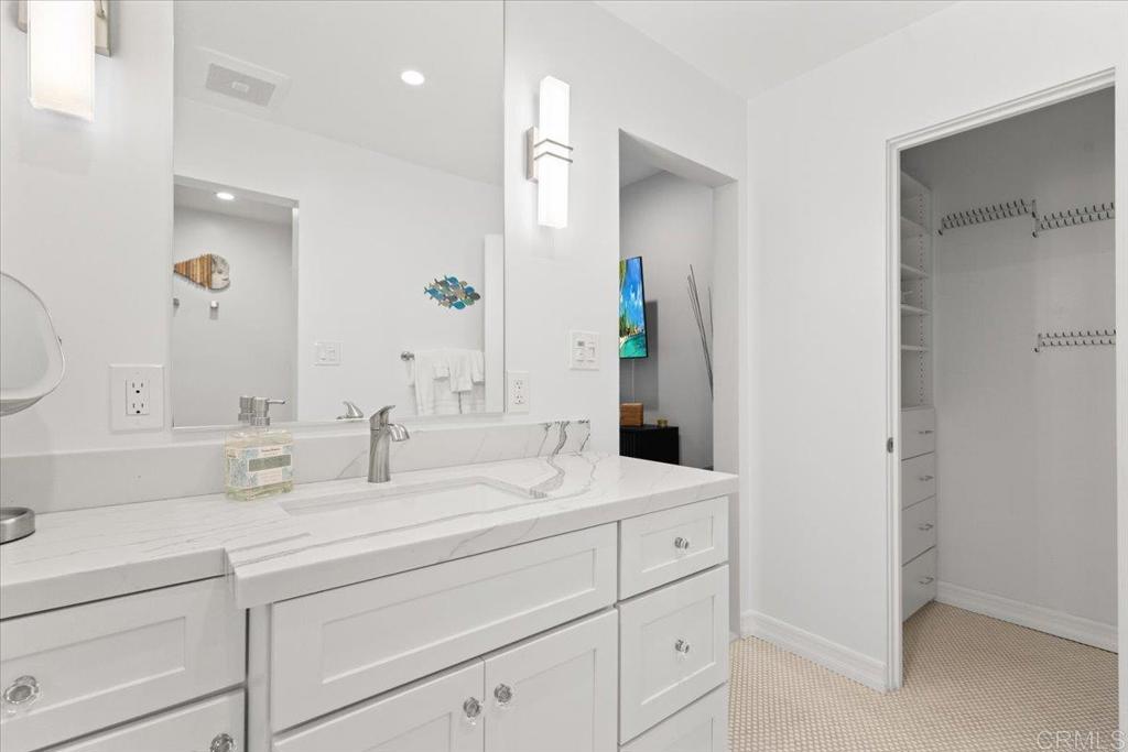 2003 Costa Del Mar Road, Unit 679 Carlsbad, CA 92009 - Photo 12 of 18 a bathroom with double vanity sink and a mirror