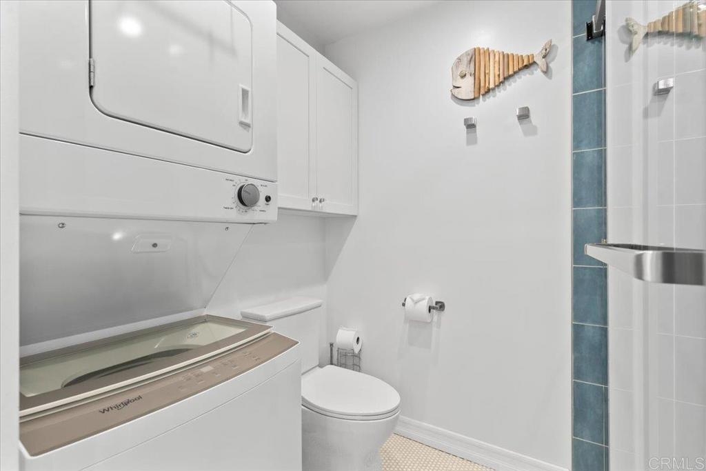 2003 Costa Del Mar Road, Unit 679 Carlsbad, CA 92009 - Photo 13 of 18 a bathroom with a toilet and a shower