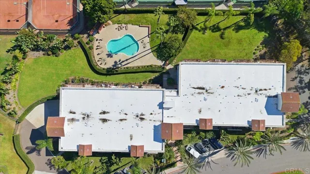 an aerial view of a houses with yard