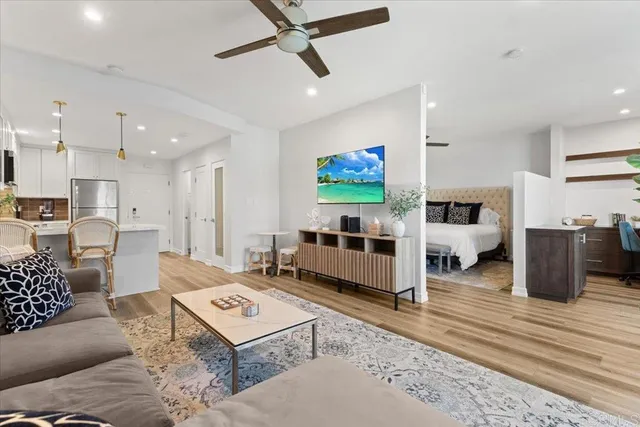 a living room with furniture and a flat screen tv
