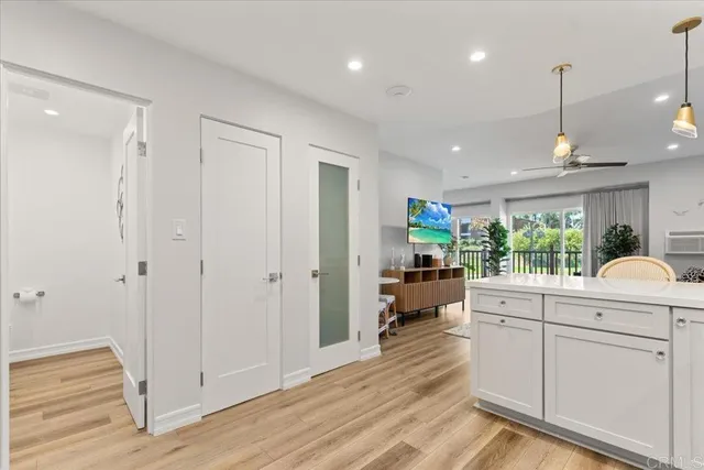 a very nice looking room with a large window and chandelier