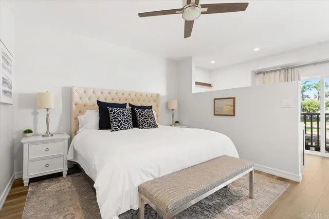 a bedroom with a bed and a night stand