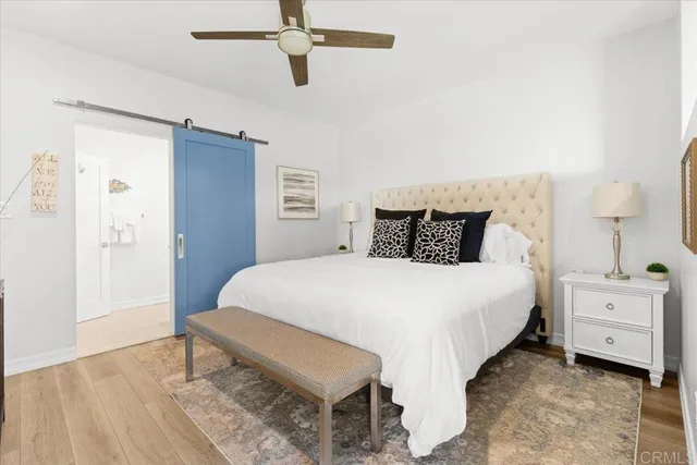 a bedroom with a bed and a table