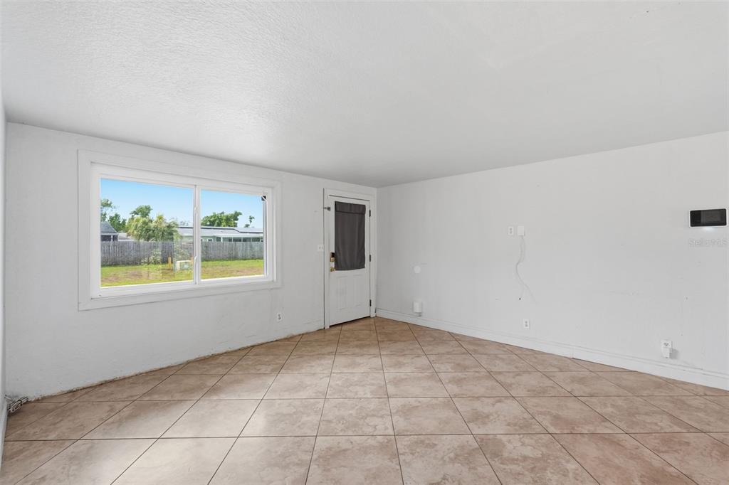 5421 64th Avenue North Pinellas Park, FL 33781 - Photo 11 of 43 an empty room with windows