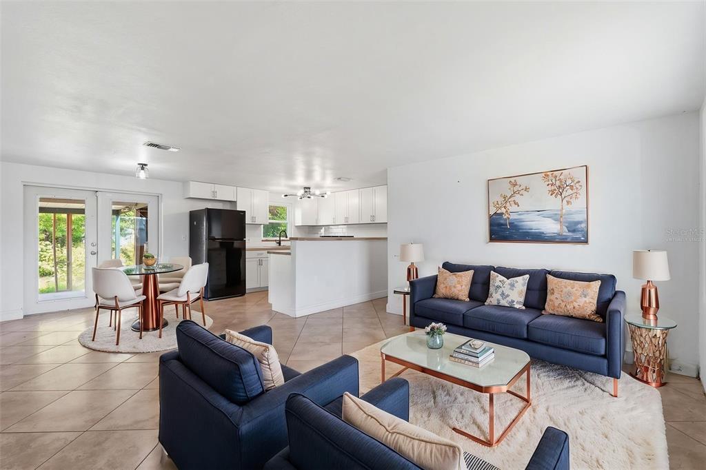 5421 64th Avenue North Pinellas Park, FL 33781 - Photo 13 of 43 a living room with furniture and a kitchen view