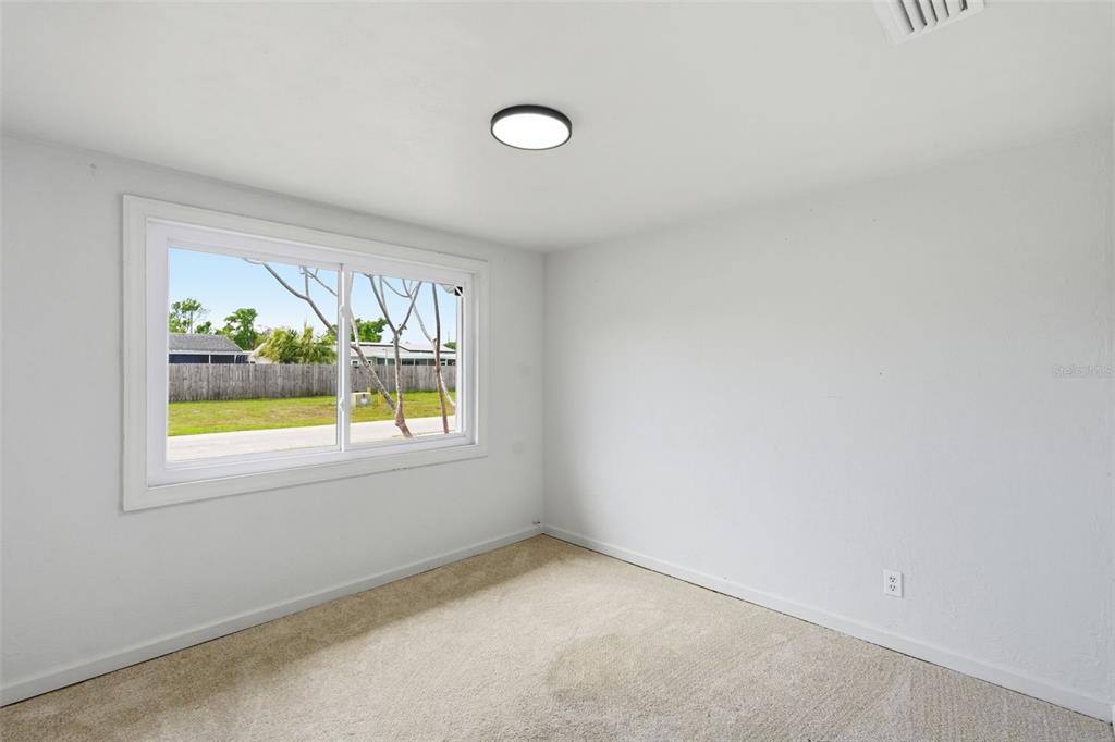 5421 64th Avenue North Pinellas Park, FL 33781 - Photo 14 of 43 an empty room with a window