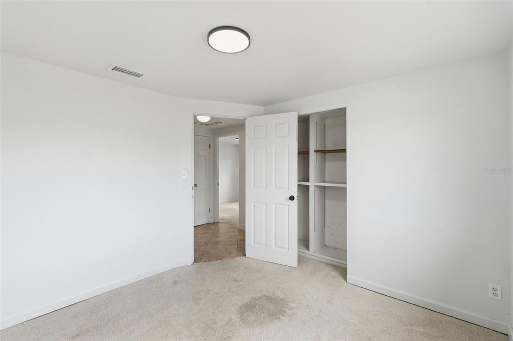 5421 64th Avenue North Pinellas Park, FL 33781 - Photo 16 of 43 an empty room with closet area