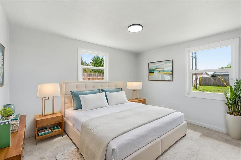 5421 64th Avenue North Pinellas Park, FL 33781 - Photo 18 of 43 a bedroom with a bed and a window