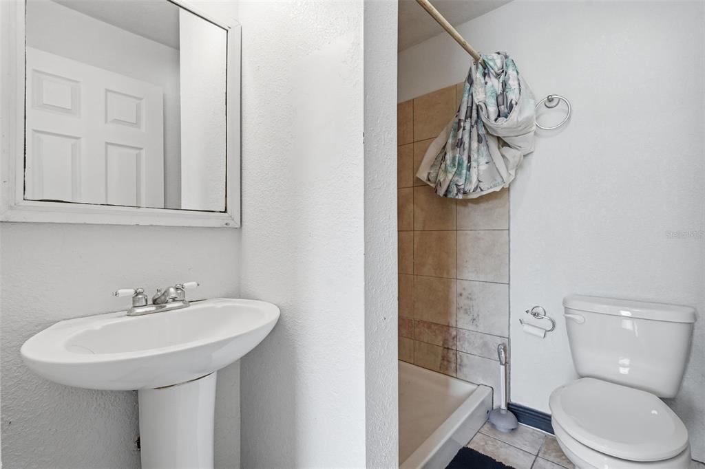 5421 64th Avenue North Pinellas Park, FL 33781 - Photo 30 of 43 a bathroom with a sink a toilet and bathtub