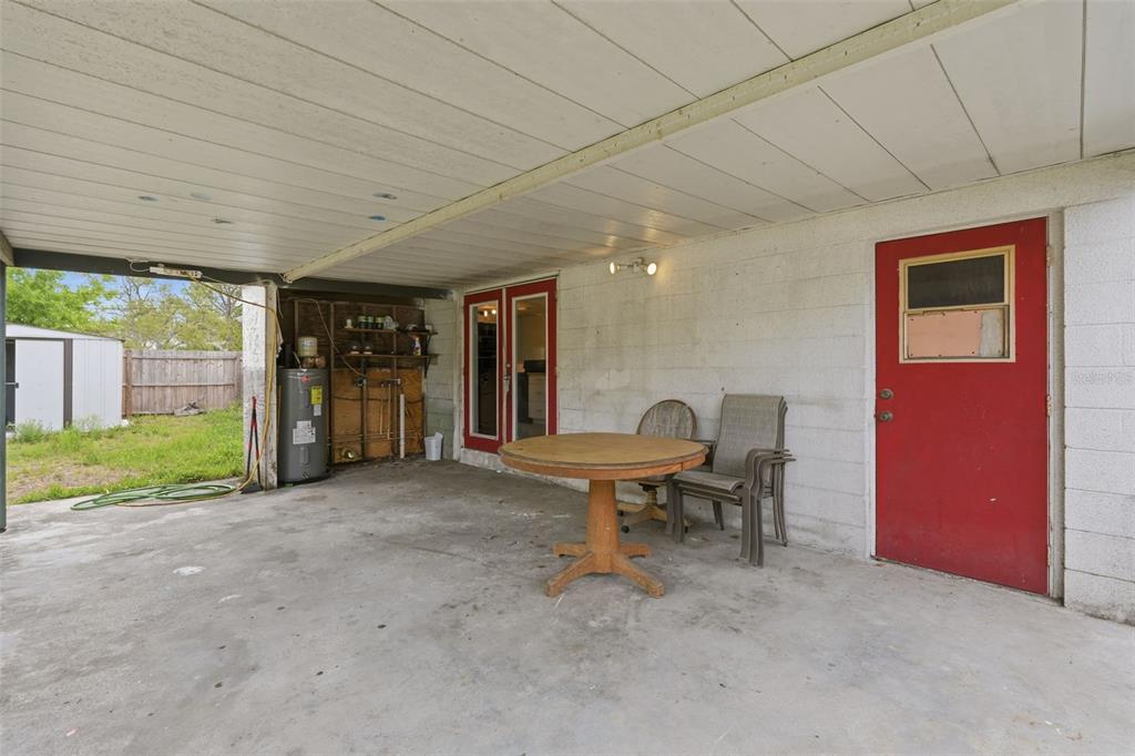 5421 64th Avenue North Pinellas Park, FL 33781 - Photo 32 of 43 a living room with furniture and a floor to ceiling window