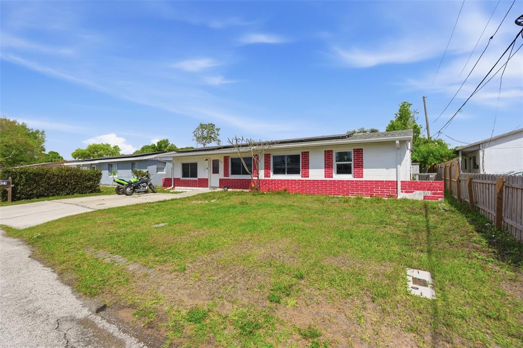 5421 64th Avenue North Pinellas Park, FL 33781 - Photo 40 of 43 a view of a house with a backyard porch and sitting area