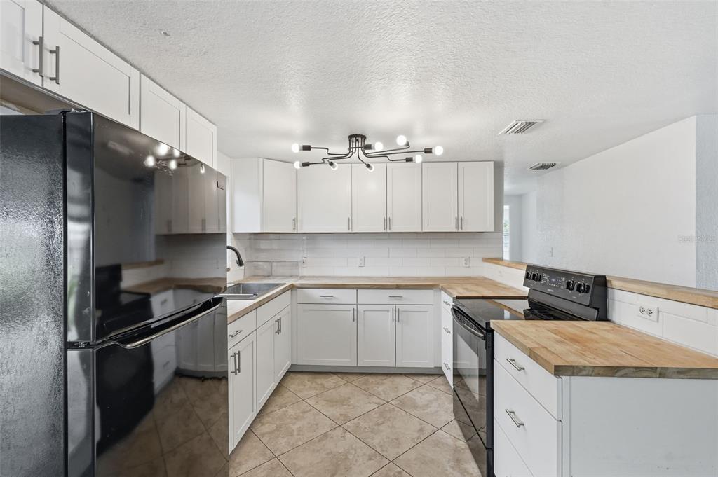 5421 64th Avenue North Pinellas Park, FL 33781 - Photo 6 of 43 a kitchen with a sink and cabinets