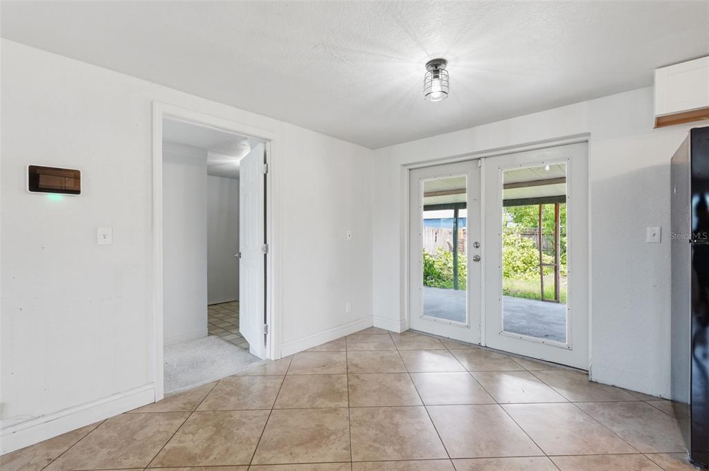 5421 64th Avenue North Pinellas Park, FL 33781 - Photo 9 of 43 a view of an empty room with window and bathroom