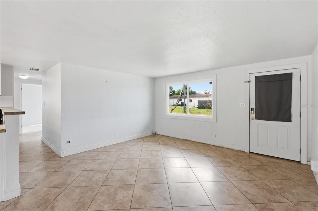 5421 64th Avenue North Pinellas Park, FL 33781 - Photo 10 of 43 a view of an empty room with a window
