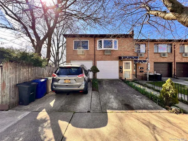 a car parked in front of a house