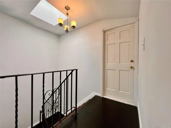 a view of entryway with wooden floor
