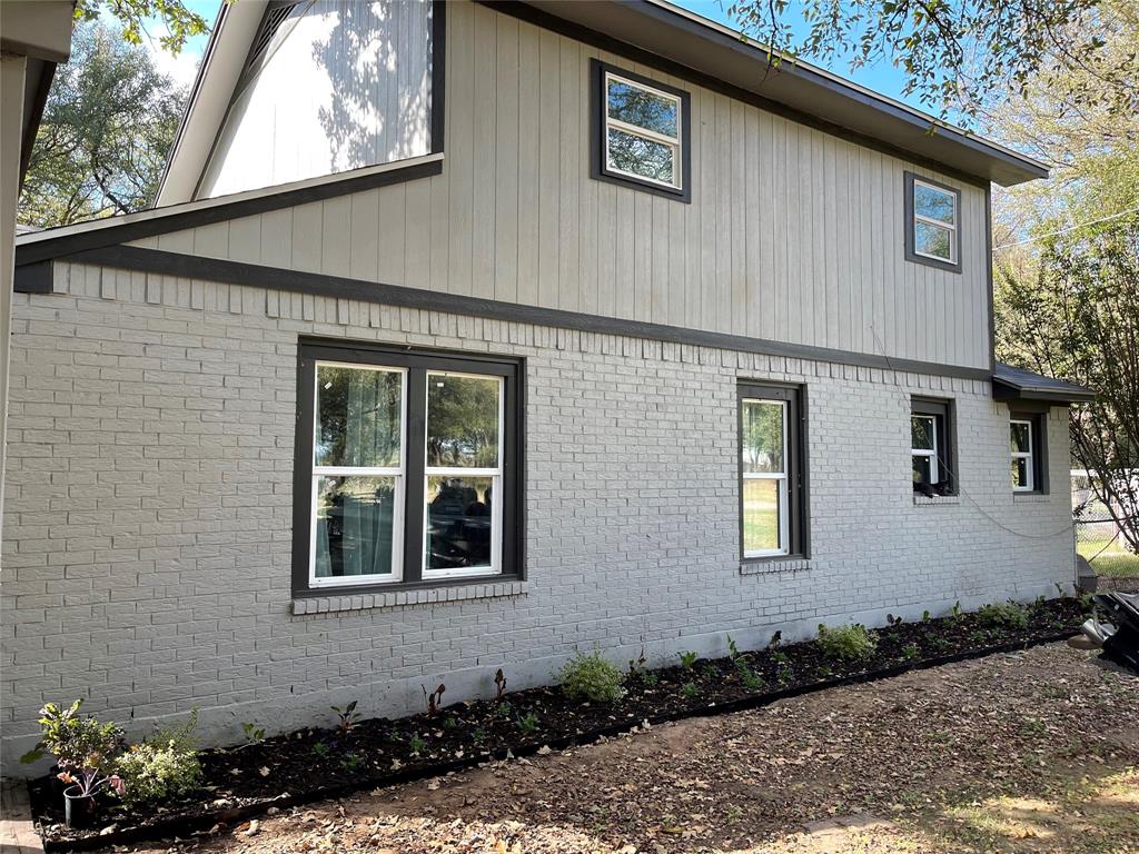 150 Ash Creek Court Springtown, TX 76082 - Photo 2 of 20 View of side of property with brick siding