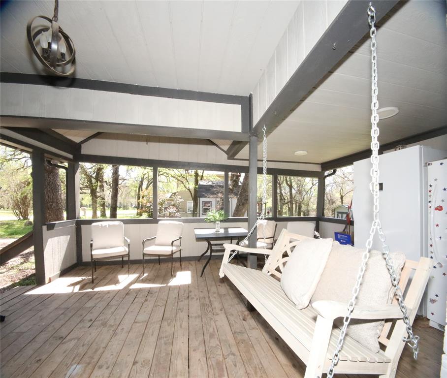 150 Ash Creek Court Springtown, TX 76082 - Photo 3 of 20 Wooden terrace with outdoor lounge area