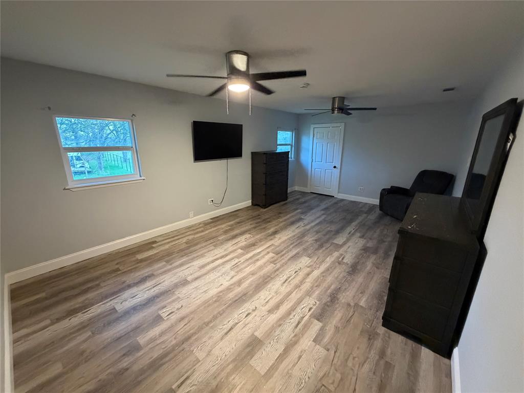 150 Ash Creek Court Springtown, TX 76082 - Photo 6 of 20 Upstairs room featuring light wood-type flooring and baseboards