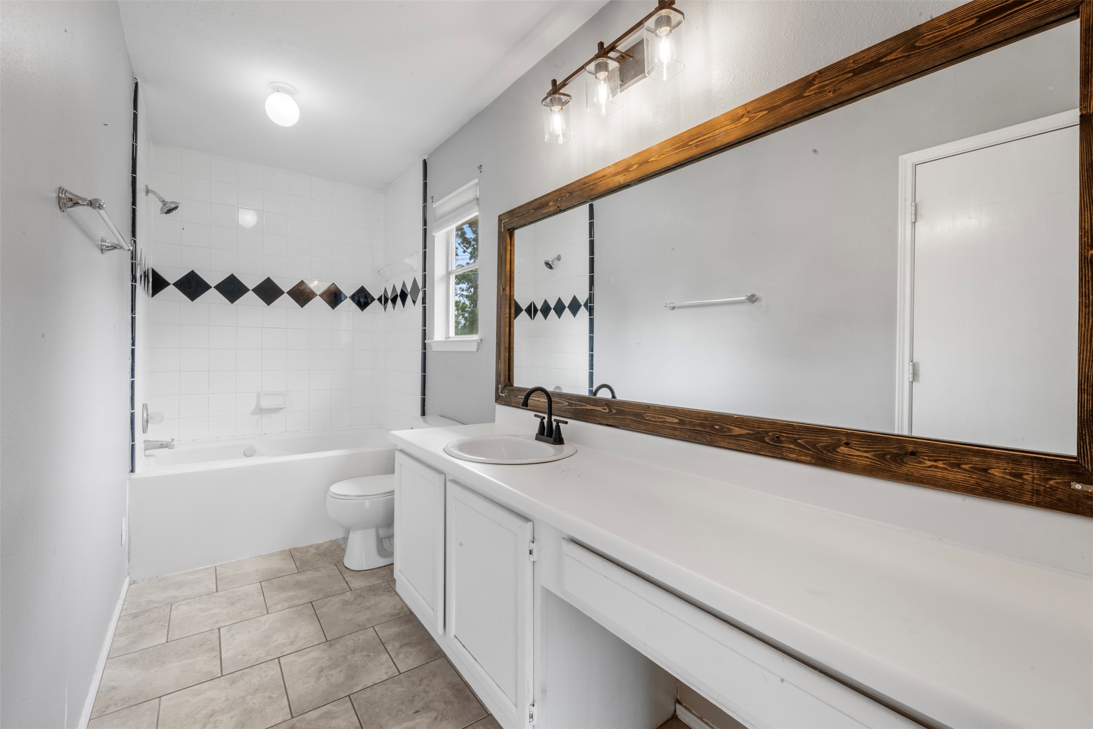 3722 Oaklace Drive Spring, TX 77389 - Photo 18 of 37 a bathroom with a sink a toilet and shower